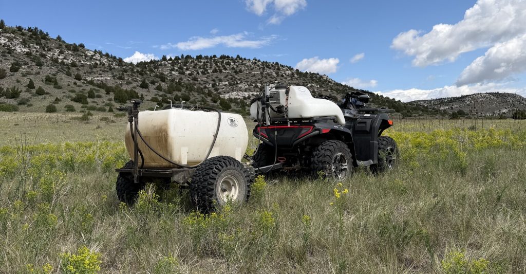 Four-wheeler used for pasture weed management